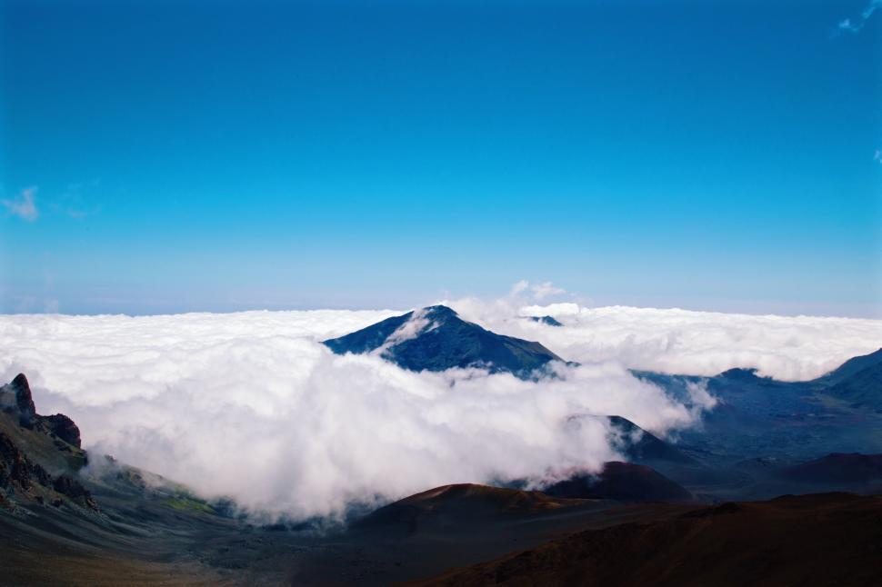 Free Image of Majestic Mountain Range and Clouds Seen From Summit 