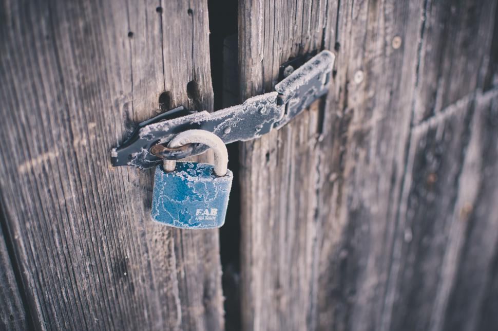 Free Image of Lock on a Wooden Door With Padlock 