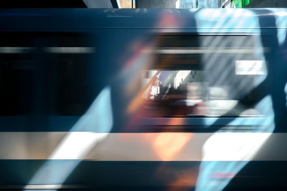 Free Image of Blurry Person Sitting on Train 