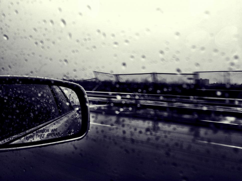 Free Image of Rainy Day Reflections: Car Side View Mirror 