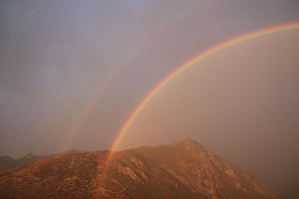 Free Image of Double Rainbow in the Sky Over a Mountain 