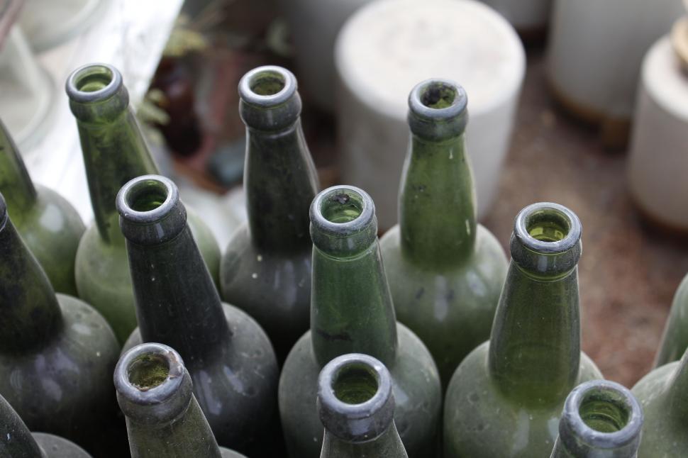 Free Image of Group of Green Bottles Arranged in a Row 