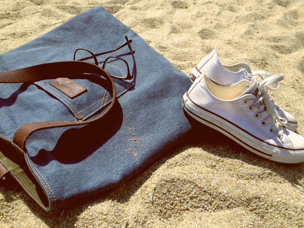 Free Image of Shoes and Bag on Sand 