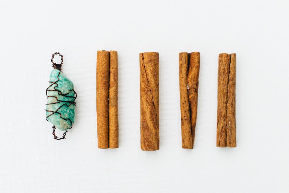 Free Image of Group of Cinnamon Sticks and Piece of Glass 