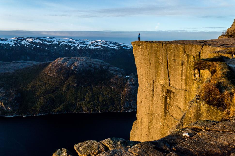 Free Image of Person Standing on Top of Cliff 