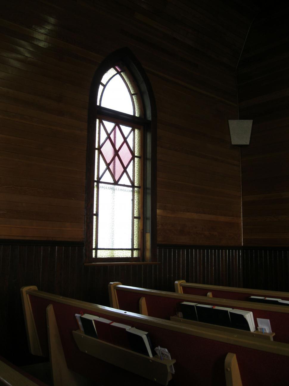 Free Image of Empty Church With Pews and Stained Glass Window 