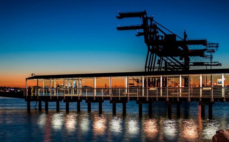 Free Image of Pier With Large Structure in Water 