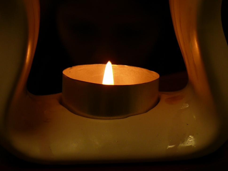 Free Image of Illuminated Candle on Table 