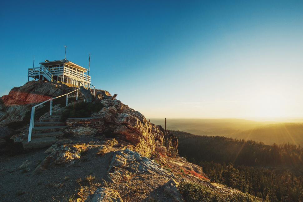 Free Image of House on Mountain Top at Sunset 