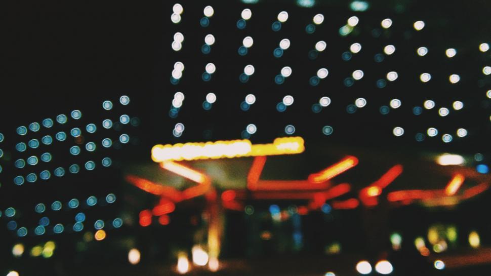 Free Image of Blurry Carnival Ride at Night 