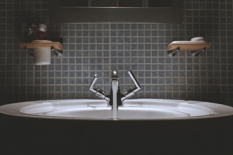 Free Image of Bathroom Sink With Faucet and Soap Dispenser 