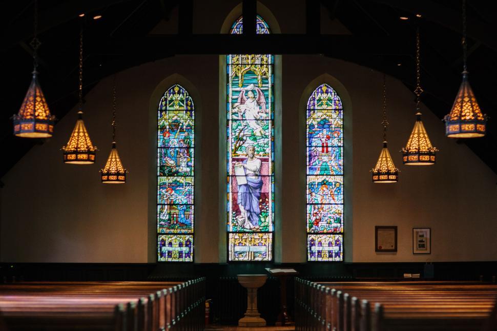 Free Image of Church With Stained Glass Windows and Pews 