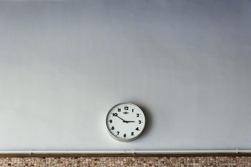Free Image of Clock Mounted on Wall 