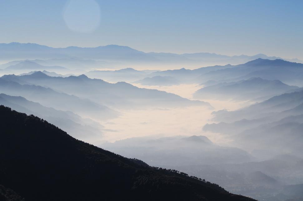 Free Image of Mountain Range Covered in Fog 