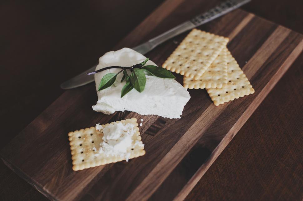 Free Image of Wooden Cutting Board With Crackers and Cheese 