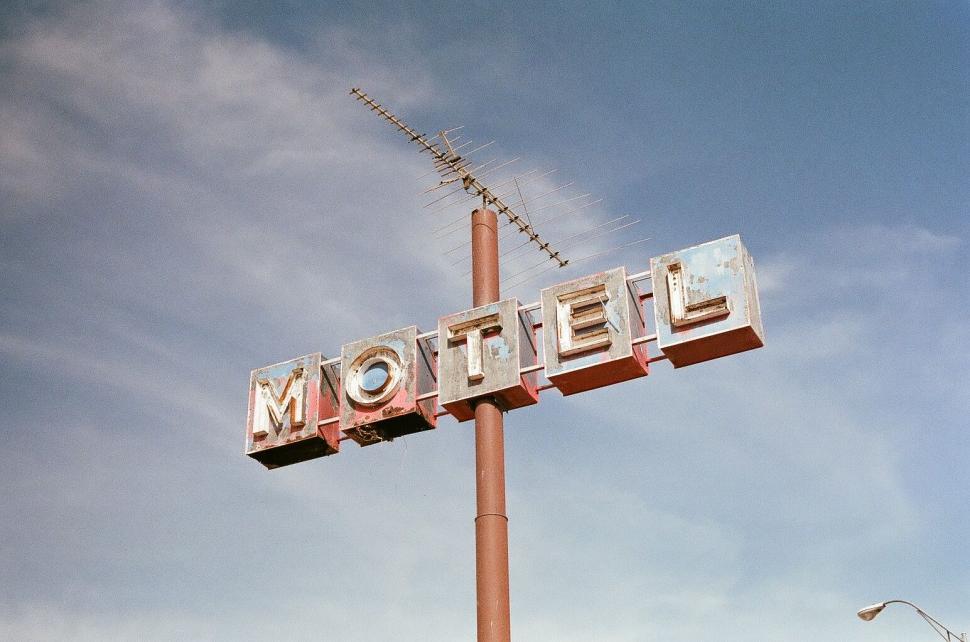 Free Image of Motel Sign Mounted on Pole 