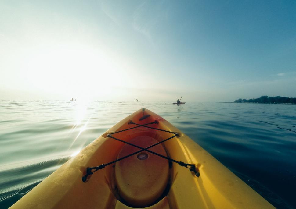 Free Image of Yellow Kayak Floating in Open Water 