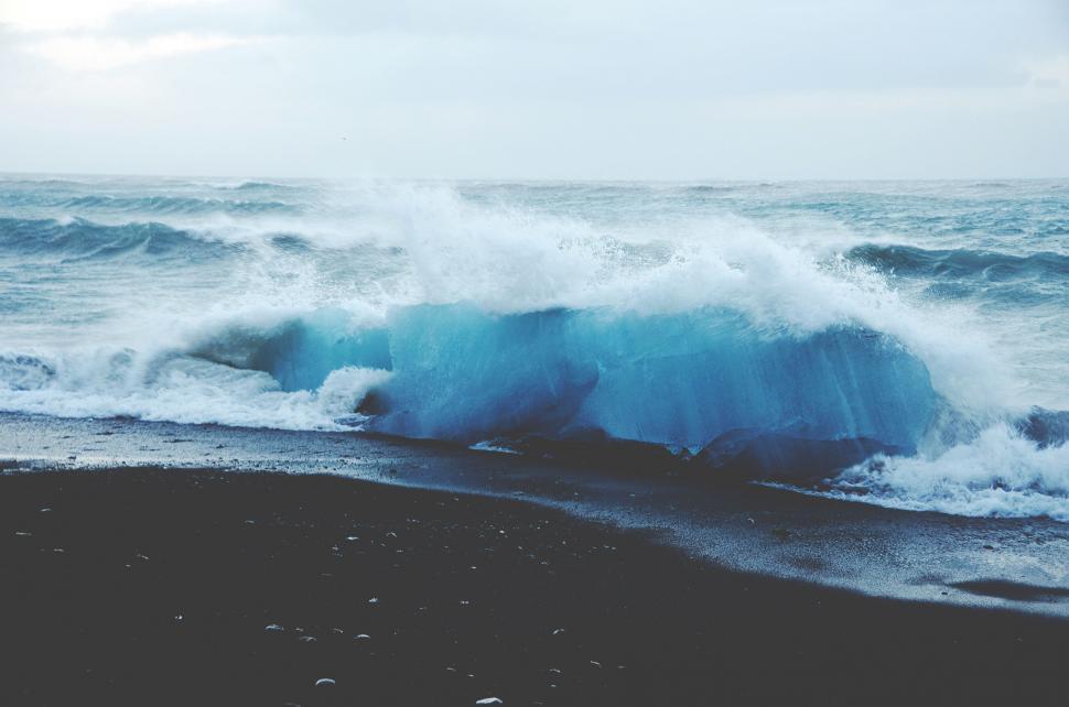 Free Image of Massive Blue Wave Crashing Into the Ocean 