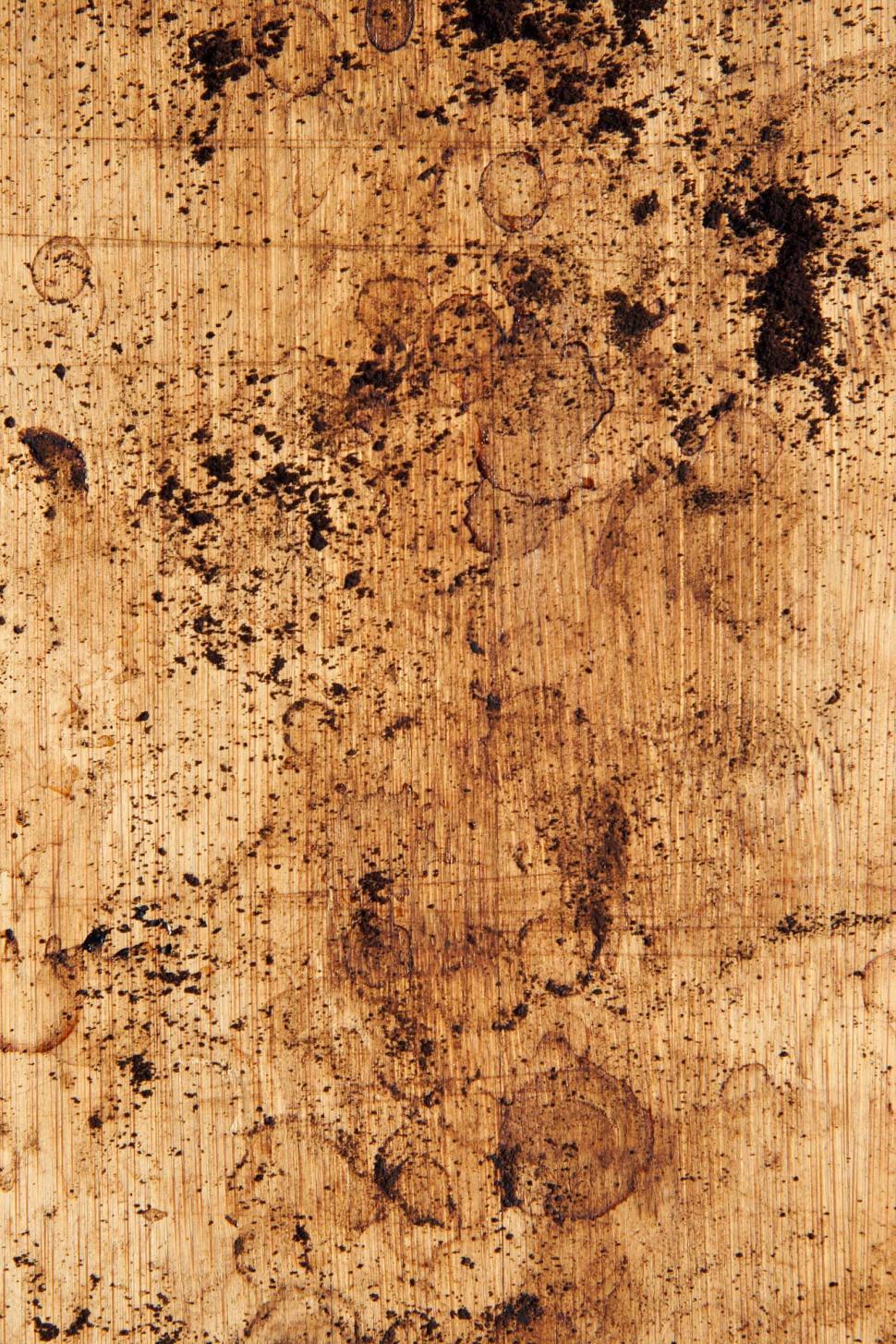 Free Image of Coffee Grounds on Wooden Counter 