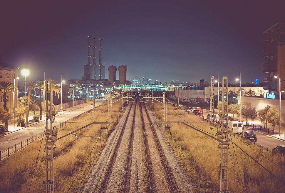 Free Image of Train Track Running Through City at Night 