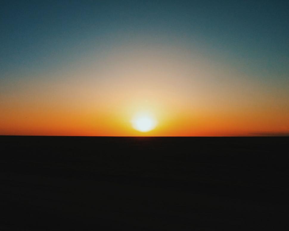 Free Image of Sun Setting Over Horizon of Field 
