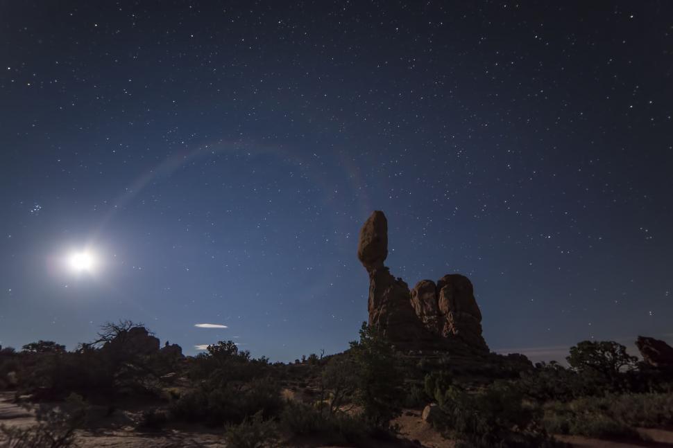 Free Image of Full Moon Shining Above Desert Landscape 