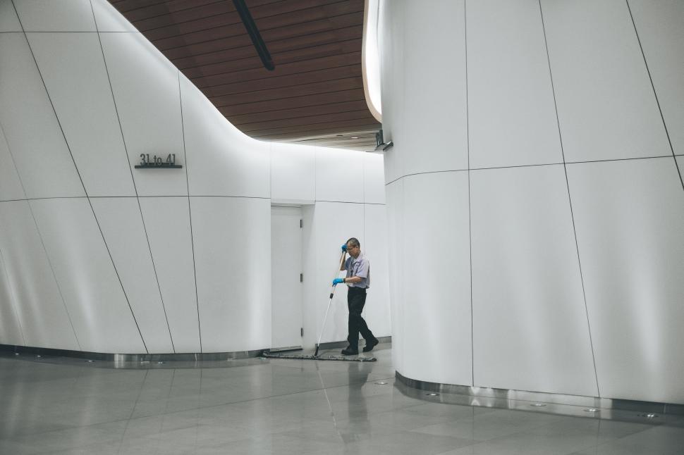 Free Image of Woman Standing in Front of Building 
