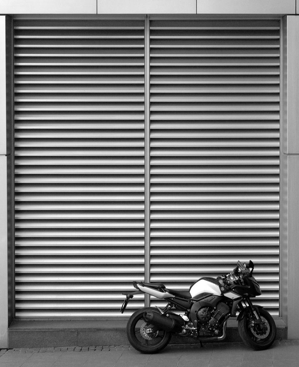 Free Image of Motorcycle Parked in Front of Building 