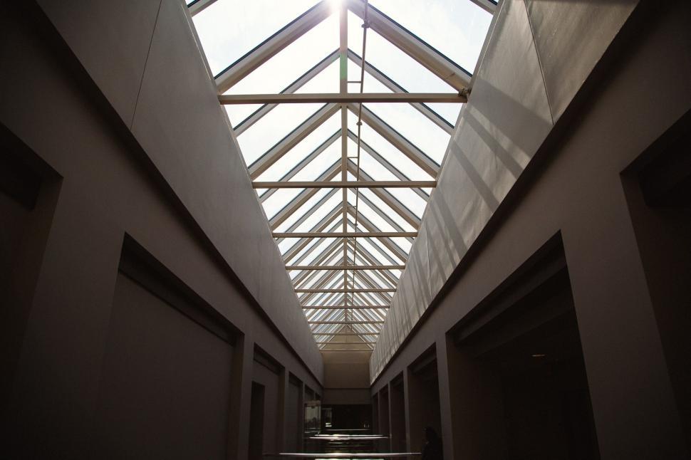 Free Image of Illuminated Long Hallway With Skylight 
