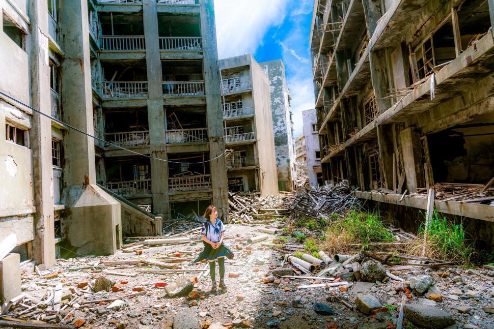 Free Image of Person Standing in Destroyed Building 