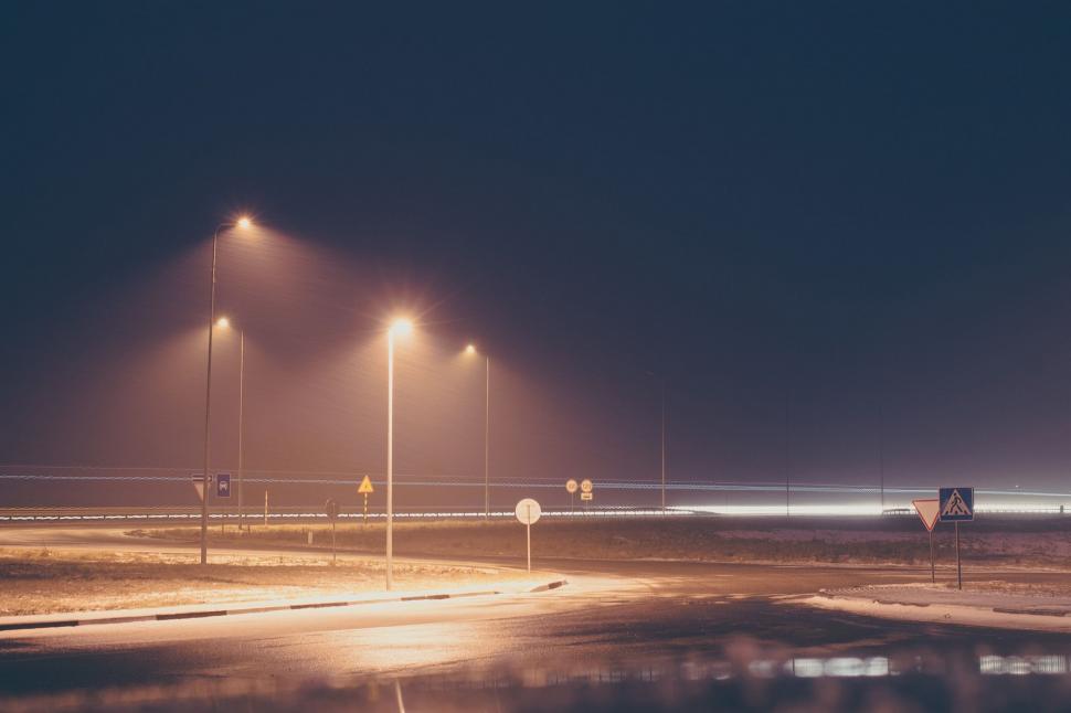 Free Image of Two Street Lights Alongside a Road 