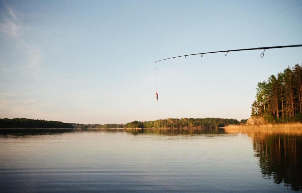 Free Image of Fishing Rod Casts Over Lake 