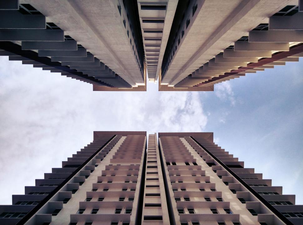 Free Image of Looking Up at Two Tall Buildings 