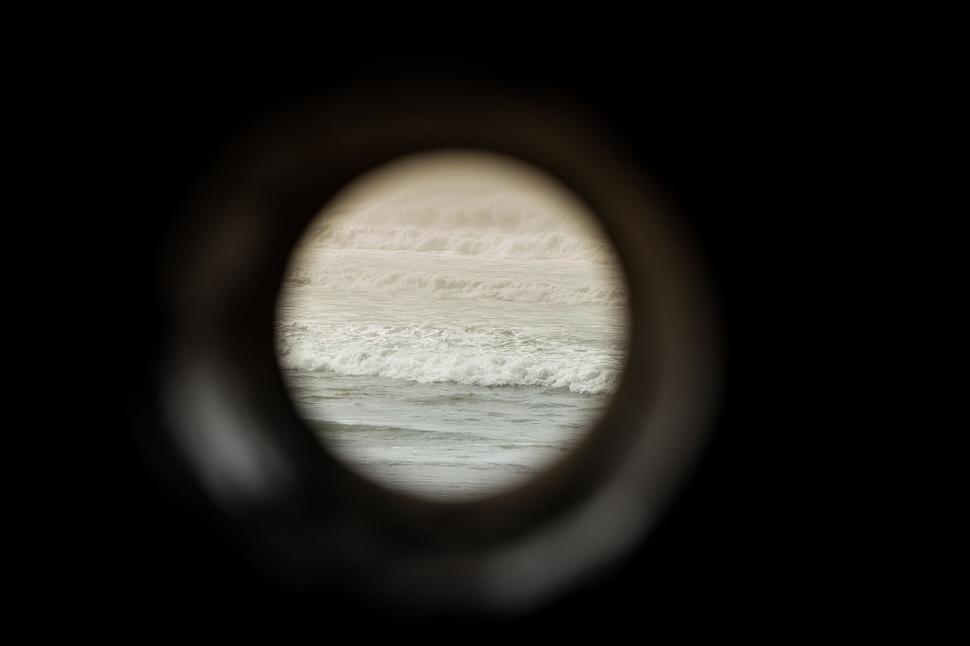 Free Image of A View Through a Scope of a Body of Water 