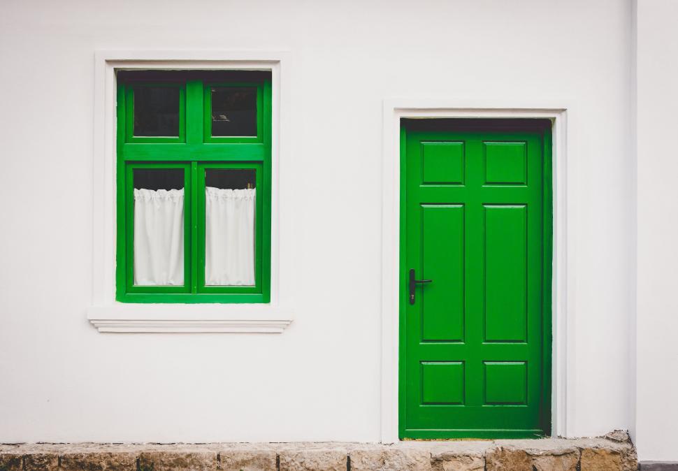 Free Image of White House With Green Door and Window 