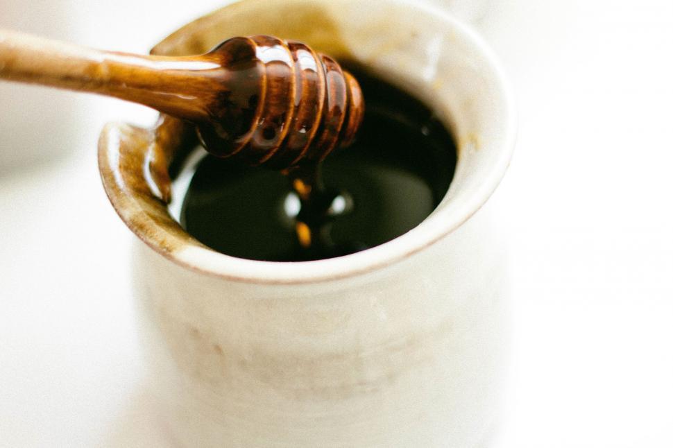 Free Image of Honey Dip Pouring Into Cup 