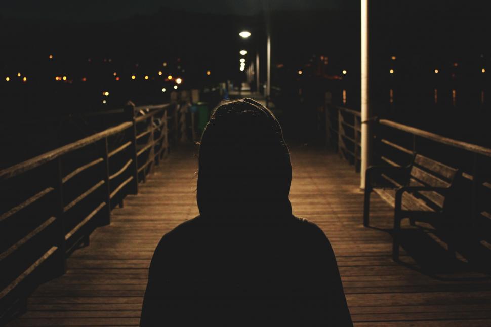 Free Image of Person Standing on Pier at Night 