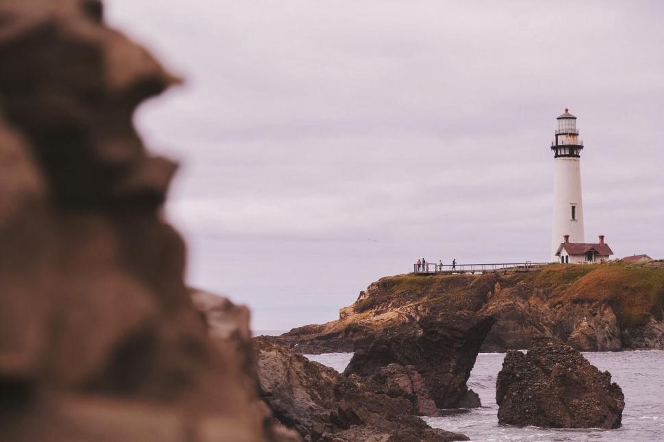 Free Image of Light House on Rocky Cliff 