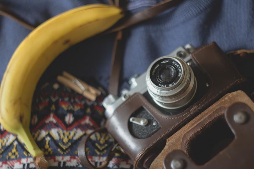 Free Image of Camera and Banana on a Blanket 
