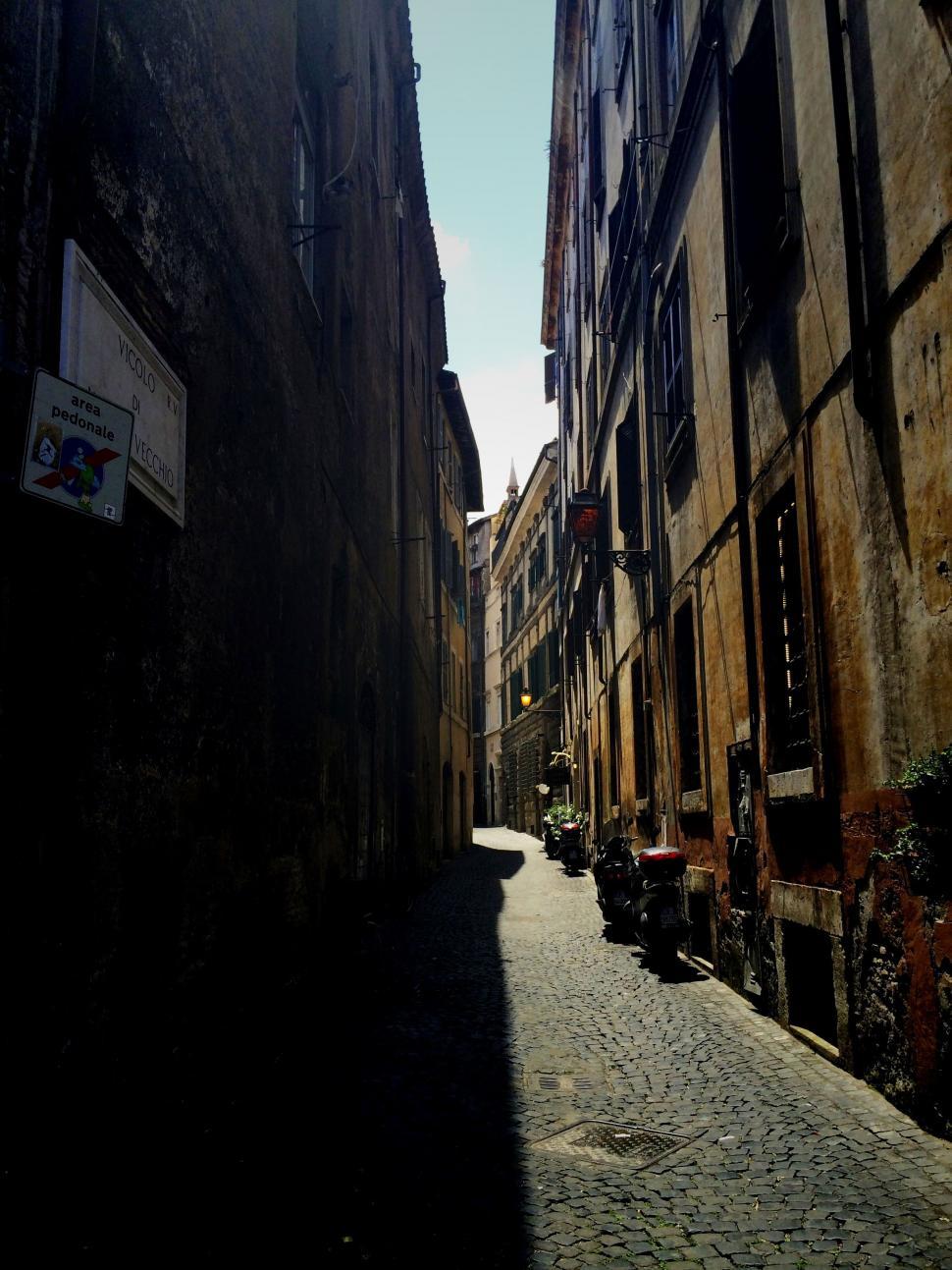 Free Image of Narrow Street With Sign 