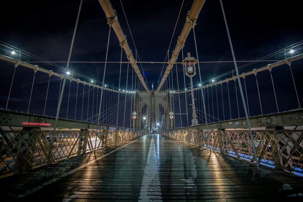 Free Image of Bridge With Clock Illuminated at Night 