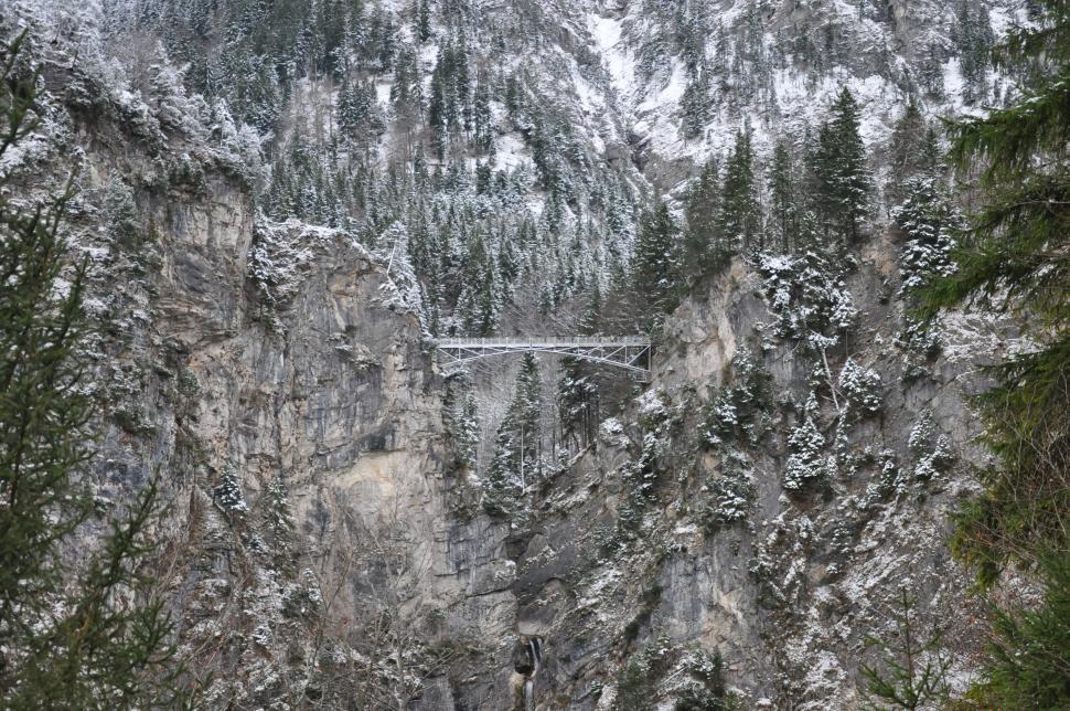 Free Image of Snow Covered Mountain With Bridge 
