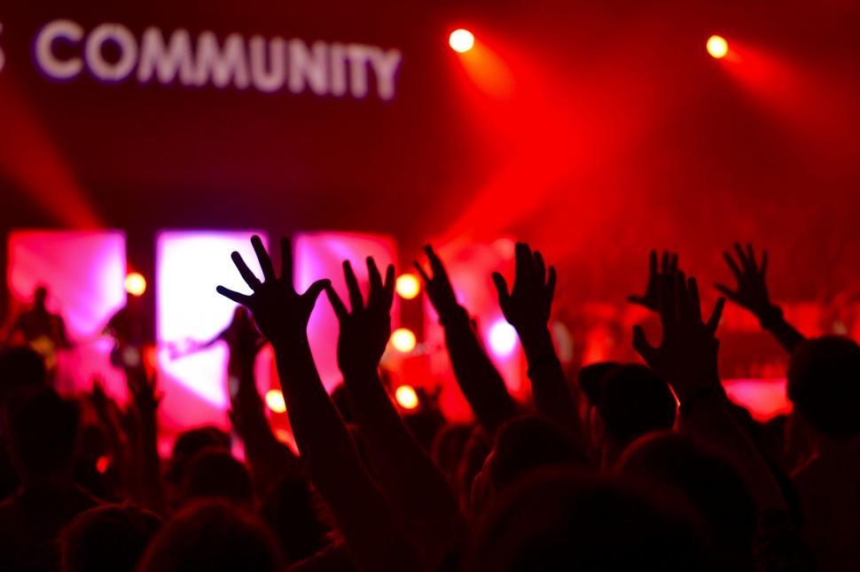 Free Image of Excited Crowd With Raised Hands at Concert 