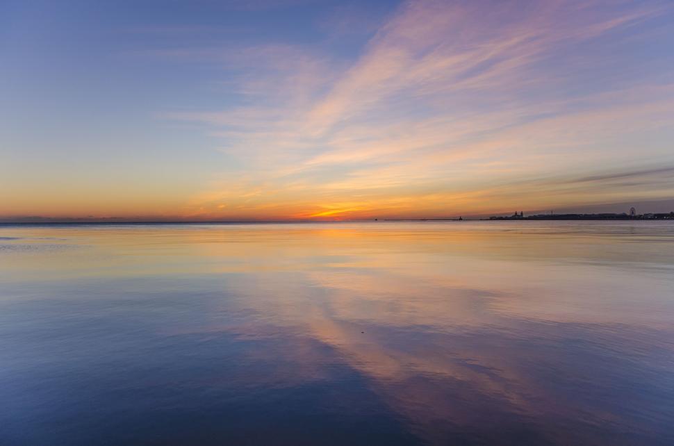 Free Image of Vast Body of Water With Sky in Background 