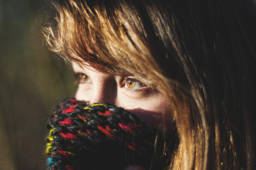 Free Image of Woman Wearing Knitted Scarf Covering Her Face 