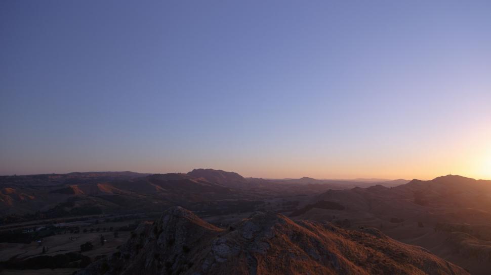 Free Image of Sun Setting Over Mountain Range 