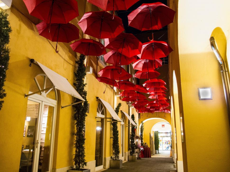 Free Image of Red Umbrellas Hanging From Ceiling 