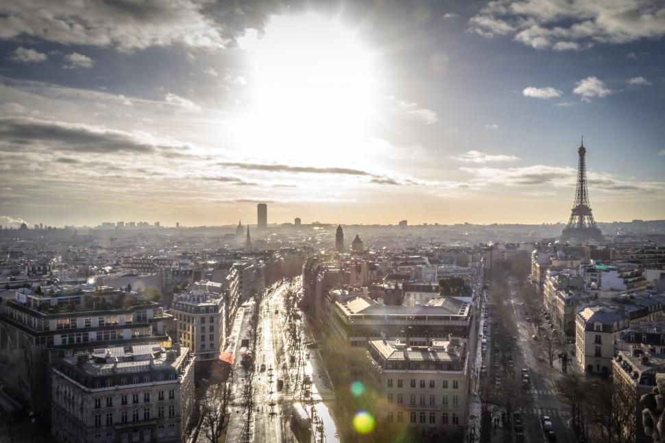 Free Image of The Sun Shining Over the City of Paris 