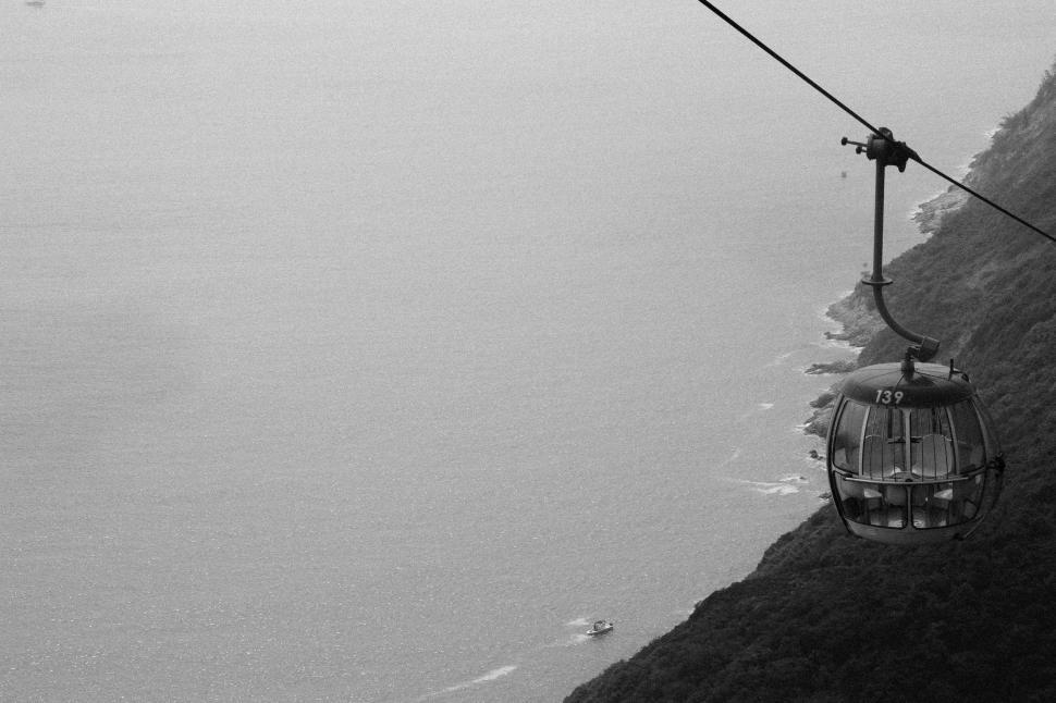 Free Image of A Black and White Photo of a Cable Car 