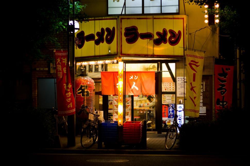 Free Image of Small Asian Restaurant Illuminated at Night 